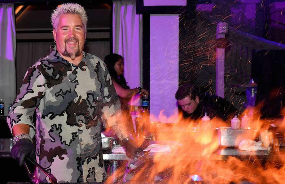 Bay Area restaurateur Guy Fieri was on the sidelines of the Oakland Raiders opening game against the Denver Broncos on Monday night.