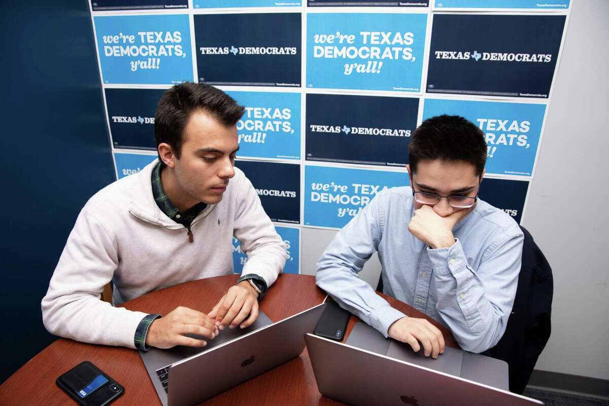Jared Hrebenar (left) and Ali Zaidi, 19-year-old sophomores at UT Austin, work on a digital plan at the Texas Democratic Party Headquarters Monday, Nov. 19, 2018 in Austin.