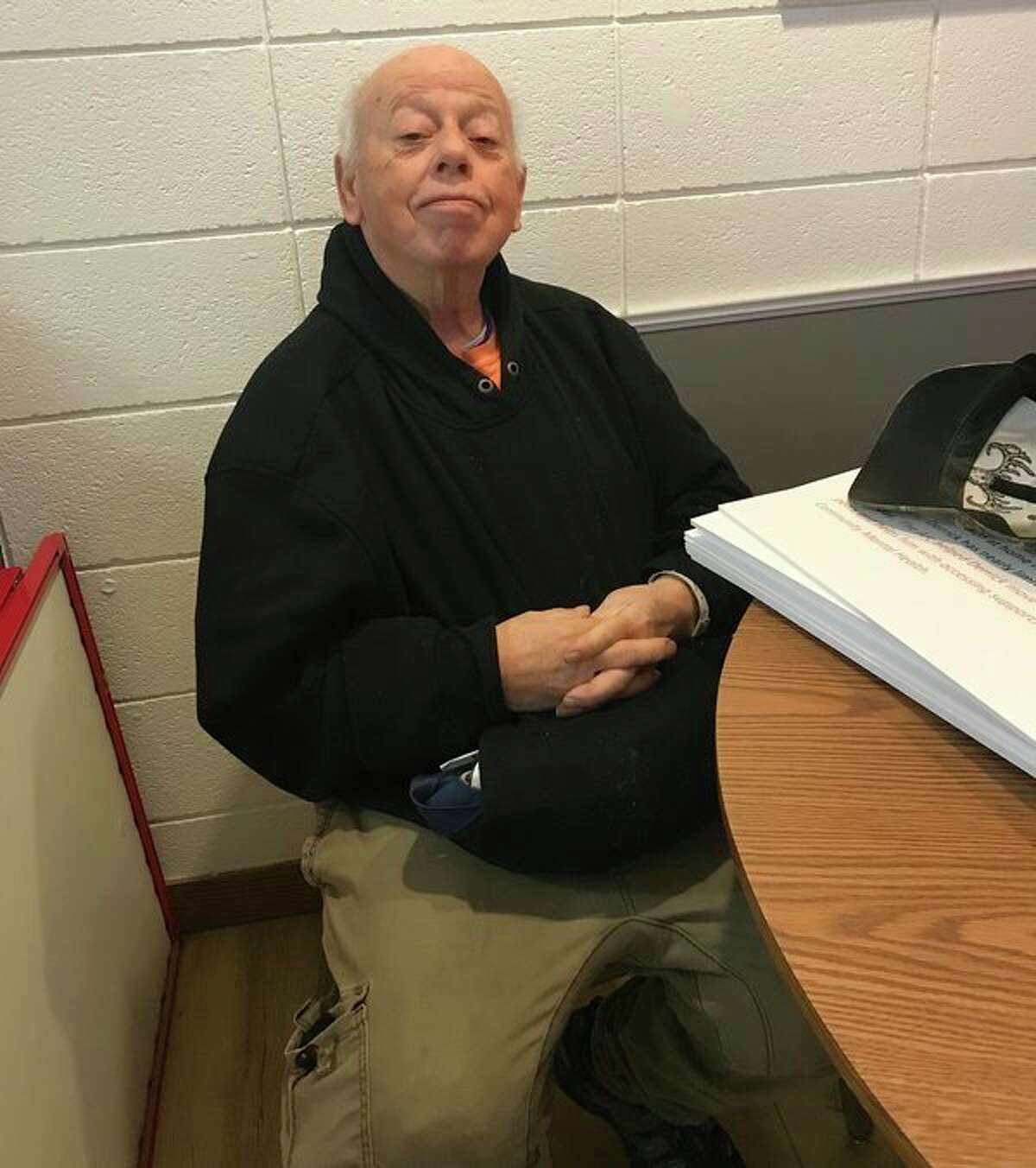 Melvin Fisher wears technology that could help local him in times of need through The Arc of Midland. (Photo provided)