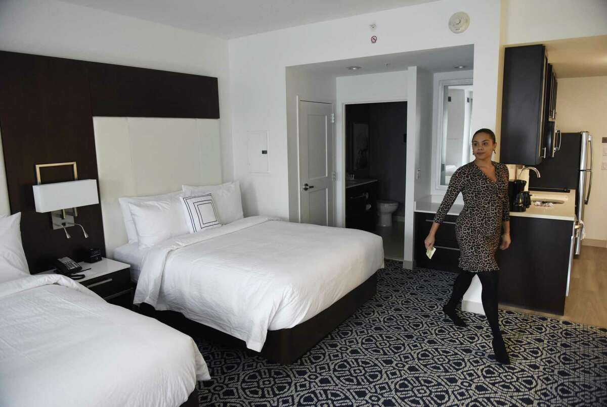 Sales and Marketing Director Tina Mazzullo shows a double queen-bed studio in the new Marriott Residence Inn extended-stay hotel at 25 Atlantic St., in downtown Stamford, Conn.