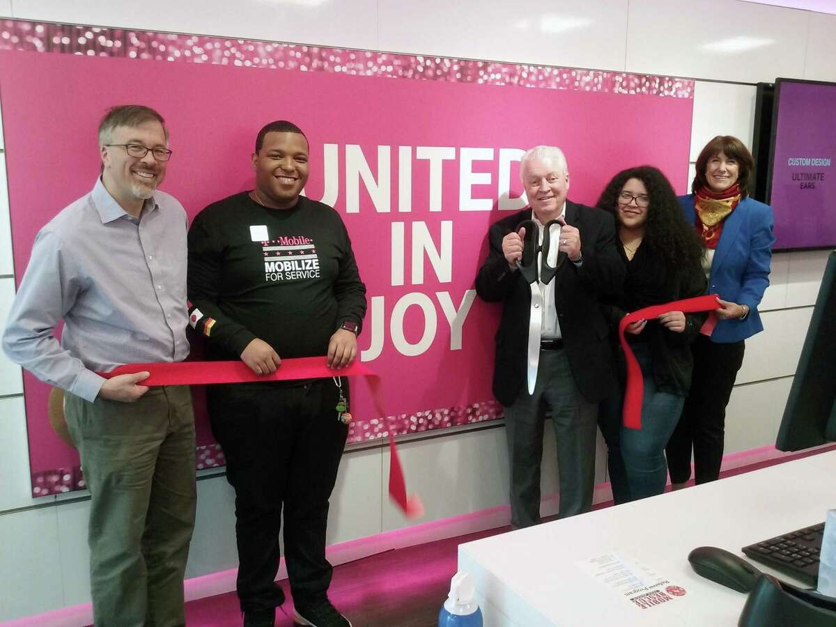 A ribbon-cutting ceremony for the new T-Mobile store at 525 Tunxis Hill Cut-Off in Fairfield was held on Nov. 16. From left, Community & Economic Development Director Mark Barnhart, mobile expert Richard Carberry, First Selectman Michael Tetreau, mobile expert Maria Rivera and Fairfield Chamber of Commerce President Beverly Balaz.