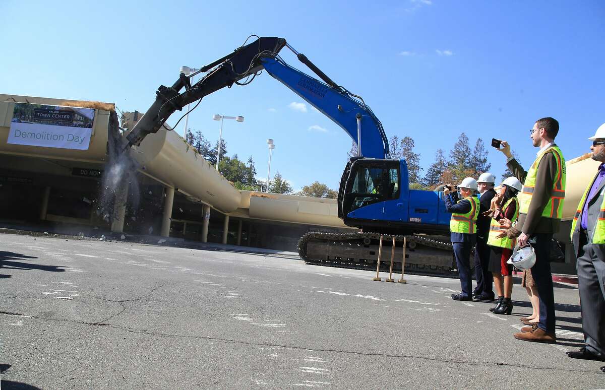 Demolition begins on the parking structure at Vallco Town Center in Cupertino, Calif. on Oct. 11, 2018. The razing of the parking structure was a prelude to the eventual demollition of the aging and all-but-vacant walk-through shopping center which is the subject of an intense community conflict regarding proposed redevelopment of the site.