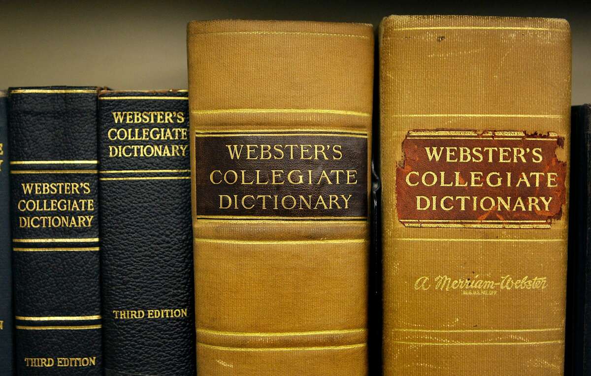 Archive copies of the Collegiate Dictionary rest on a bookshelf at the headquarters of the Merriam-Webster dictionary publisher in Springfield, Mass., Wednesday July 1, 2009. (AP Photo/Charles Krupa)