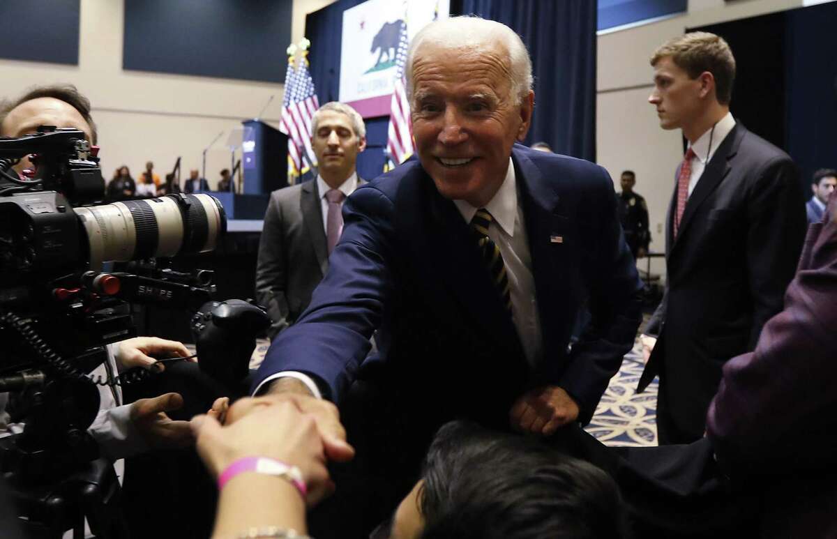Former Vice President Joe Biden shakes hands with supporters after speaking at a politcal rally at Cal State Fullerton on Oct. 4 in Fullerton, Calif. His qualities could tempt some of Trump’s base in 2020.