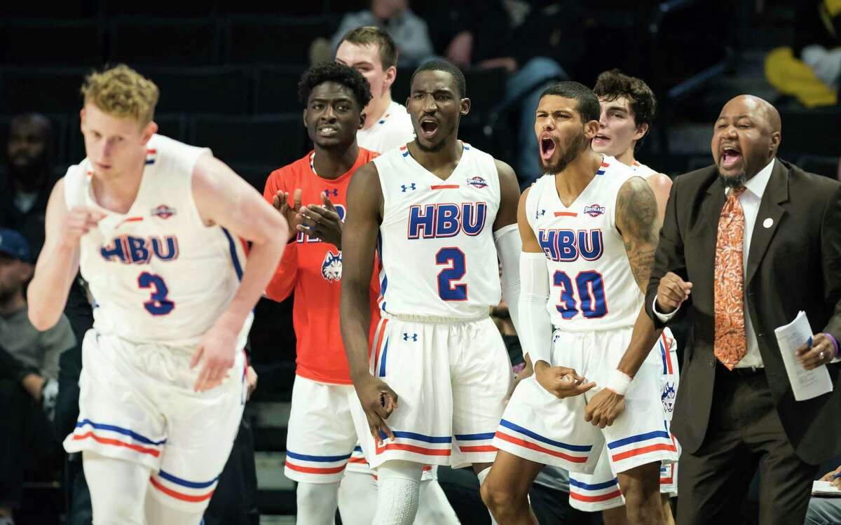 Houston Baptist players celebrate after junior forward Jackson Stent makes a three-point shot in the second half of an NCAA college basketball game Friday, Nov. 23, 2018, in Winston-Salem, N.C. (Allison Lee Isley/The Winston-Salem Journal via AP)