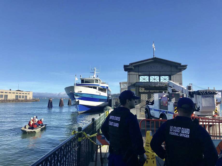 Officials from US Barrier B were surveying Gate B at the San Francisco Ferry Terminal on Saturday, November 24, 2018, a day after a ferry to Larkspur on the San Francisco Ferry Building dock. Significant nicks can be seen on the bow of the damaged ferry on the left. Photo: Lauren Hernandez / San Francisco Chronicle