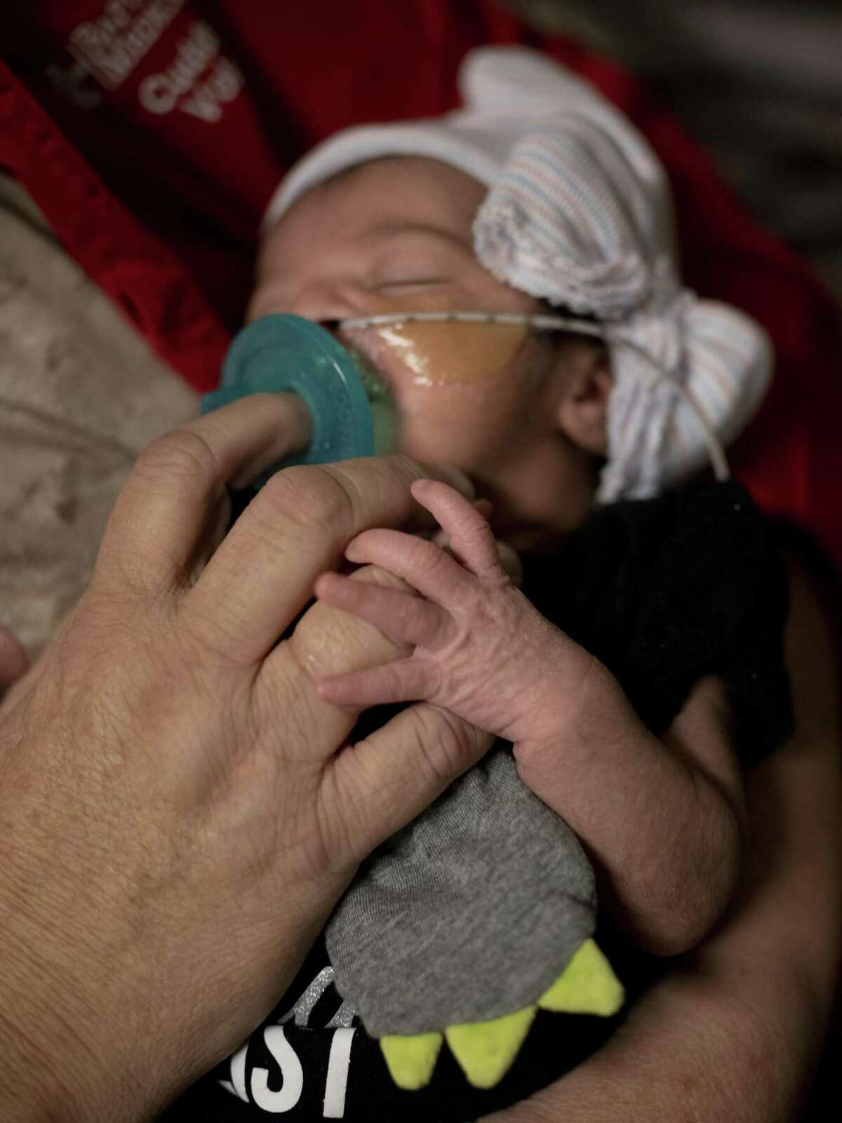 Felicity Cuellar, who was 6 days old, rests peacefully in the arms of Peggy Smith, a volunteer cuddler in the neonatal intensive care unit at Baptist Medical Center on Nov. 13, 2018. The cuddlers are specially trained volunteers who help soothe babies who were born prematurely or are recovering from neonatal abstinence syndrome.