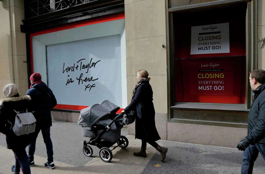 On this photo of November 20, 2018, pedestrians pass by the outsourced windows in front of the Lord & Taylor in New York. Lord & Taylor was the first department store in the city to turn its large sidewalk windows into theatrical and theatrical displays, but its parent company plans to close the Fifth Avenue store in January 2019, after a last-minute sale. (AP Photo / Seth Wenig) Photo: Seth Wenig / Copyright 2018 The Associated Press. All rights reserved.