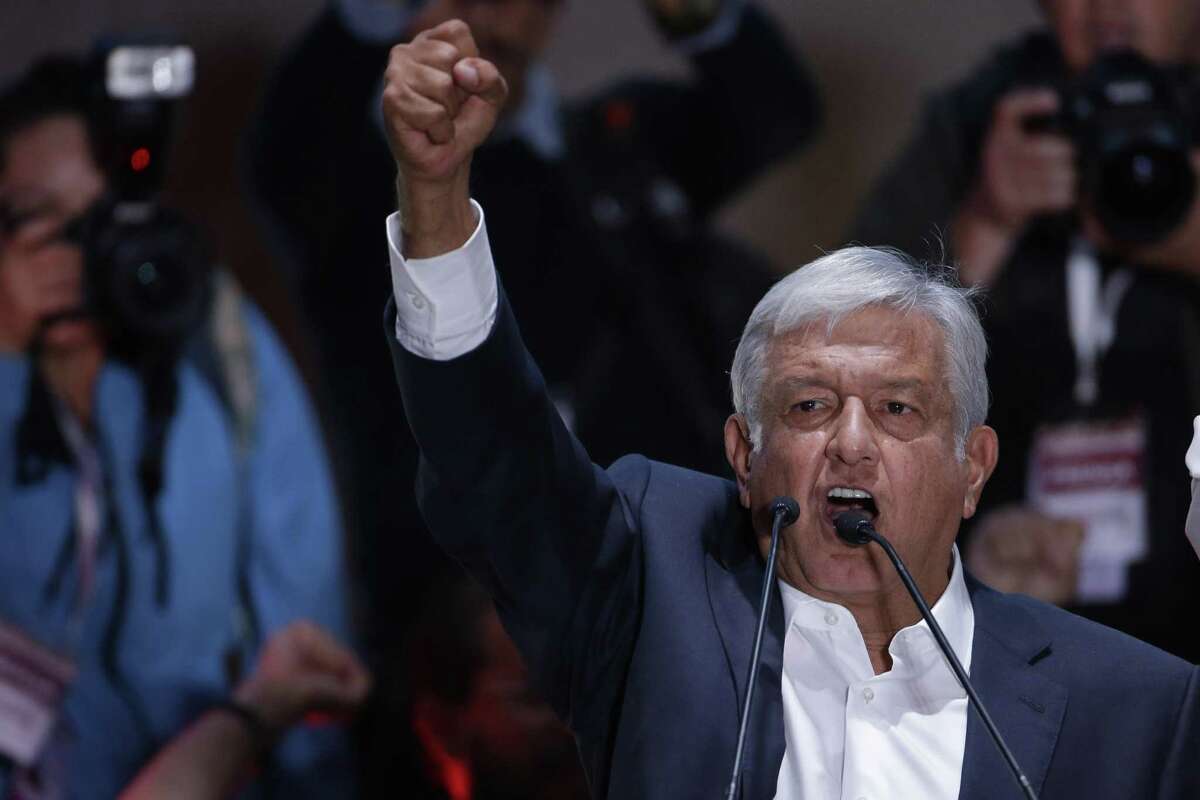 Presidential candidate Andres Manuel Lopez Obrador delivers his victory speech in Mexico City's main square, the Zocalo, Sunday, July 1, 2018. Lopez Obrador has claimed victory in Mexico's presidential election, calling for reconciliation. (AP Photo/Moises Castillo)