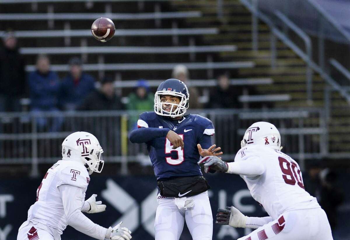 UConn quarterback David Pindell (5) gets a pass off in the first half against Temple on Saturday.