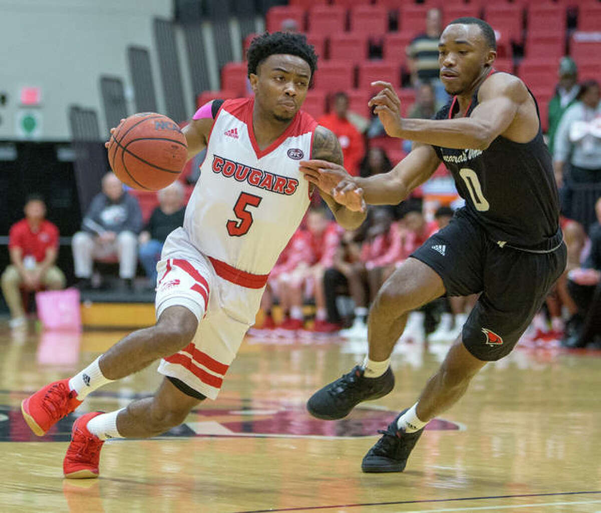 SIUE’s Tyreese Williford (left) drives past Incarnate Word’s Dwight Murray Jr. during Sunday afternoon’s Cougars victory at Vadalabene Center in Edwardsville.