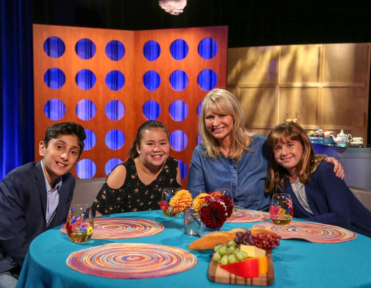 On the set of “Check, Please! Bay Area Kids” are Kian Davani (left), Cole Tao, host Leslie Sbrocco and Maddie Turner.