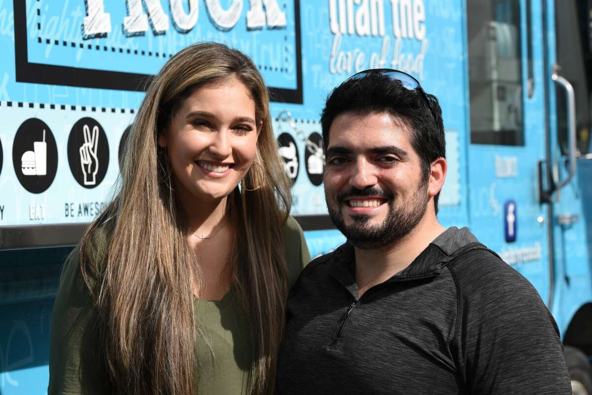 Vanessa Garcia and Miguel Pena pose for a photo during the Hecho a Mano Pop-Up Shop.