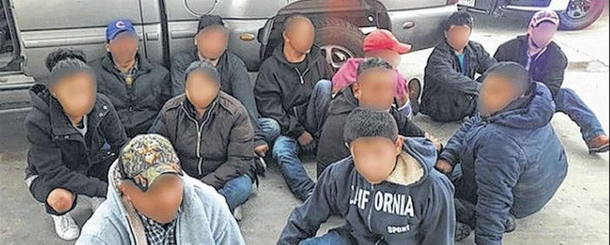 Pictured are 12 of the 13 arrested. Border patrol agents arrests a man attempting to smuggle 12 undocumented immigrants near U.S. 83.