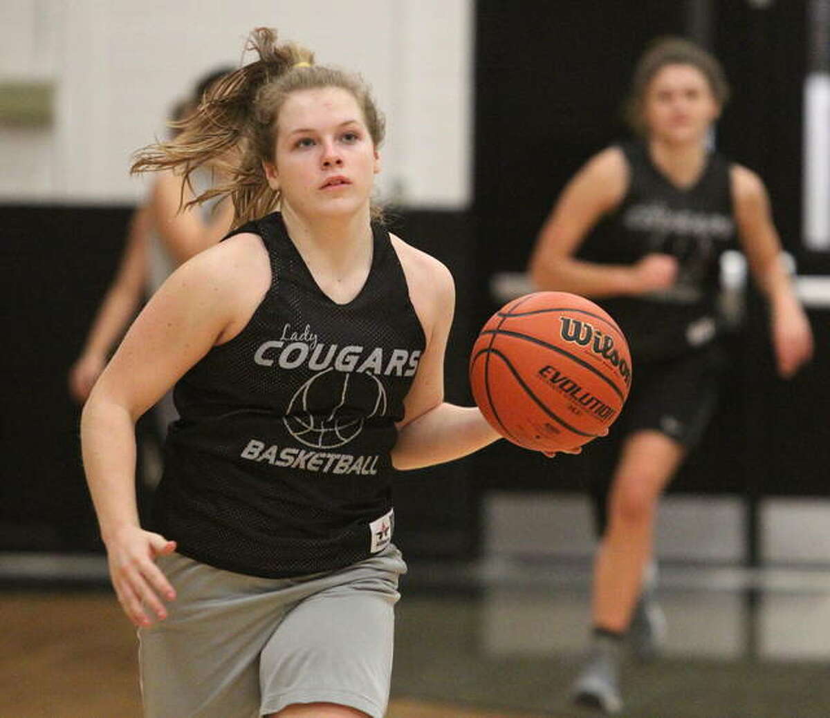 West Central’s Zaylei Evans drives to the basket during a recent practice in Bluffs. Evans, a freshman, will be the Cougars’ point guard this season.