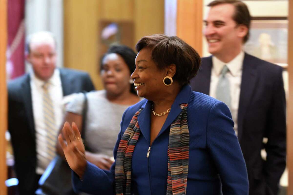 Senator Andrea Stewart-Cousins waves to a staffer as she leaves the state Senate Democratic offices with Sen. Michael Gianaris, her new deputy, right, after being named as state Senate majority leader on Monday, Nov. 26, 2018, at the Capitol in Albany, N.Y. She is the first female majority leader in either house of the state legislature. (Will Waldron/Times Union)