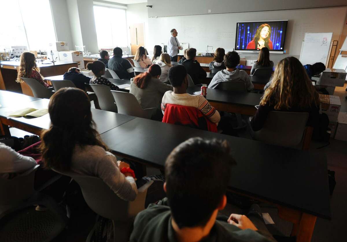 Students watch a TED talk during their first day of classes in the new Stratford High School in Stratford, Conn. on Monday, November 26, 2018.