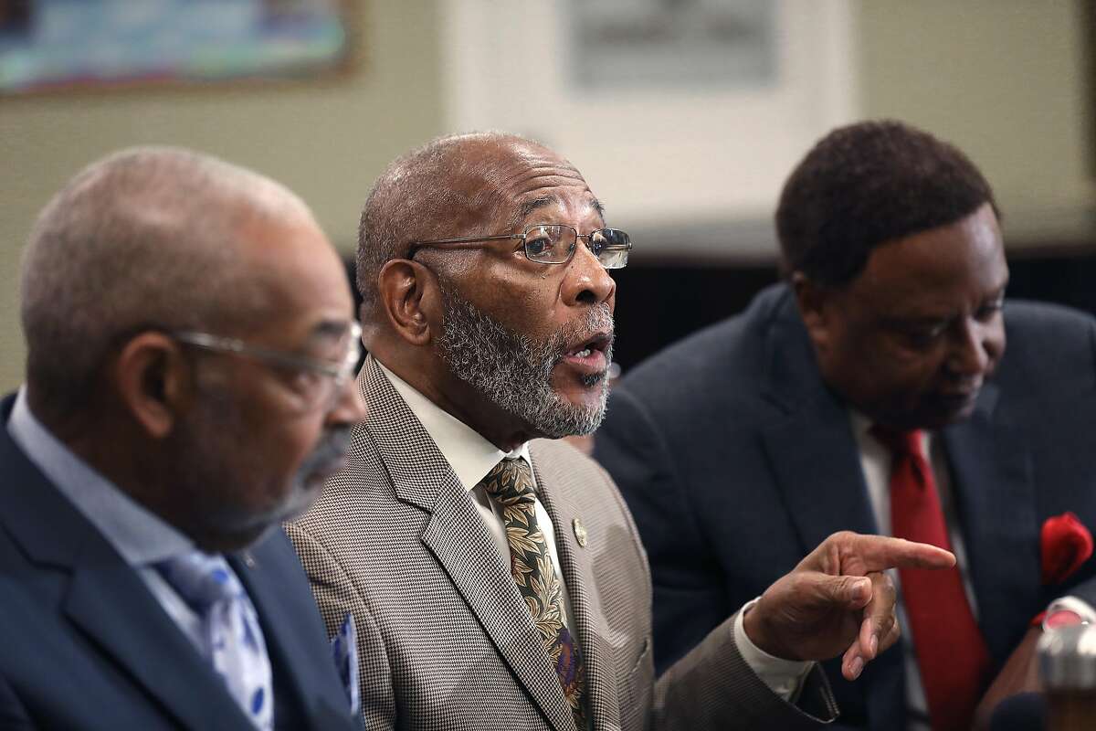 Coastal Area director Dan Daniels of NAACP (left), Doctor Amos C. Brown (middle, chairman of Religious Affairs) and attorney John Burris (right) call for a boycott of the San Francisco Giants after majority owner Charles Johnson was found to have given a political donation to Cindy Hyde-Smith, a U.S. Senate candidate in Mississippi who made comments in support of public lynchings at Third Baptist Church on Monday, Nov. 26, 2018, in San Francisco, Calif.