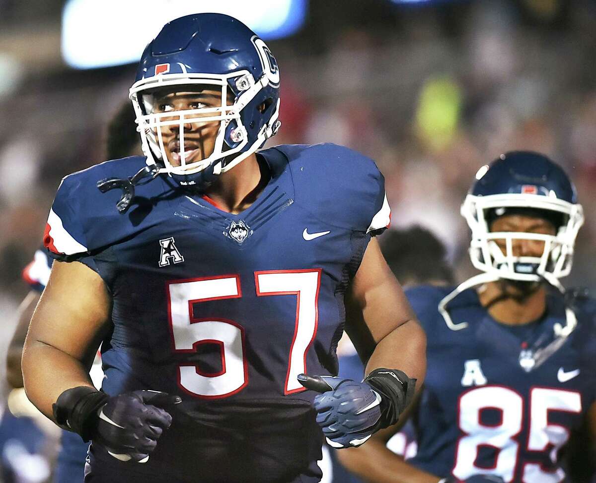 UConn freshman defensive line and former Wilbur Cross star Travis Jones runs off Rentschler Field in East Hartford at halftime in the season opener against University of Central Florida Knights in an American Athletic Conference matchup Thursday night August 30, 2018. UFC won, 56-17.