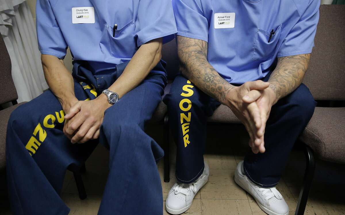 Graduates of the San Quentin Prison’s The Last Mile program Chung Kao, left, and Azraal Ford wait backstage as they prepare to show off their startup ideas at Demo Day in San Rafael, Calif.
