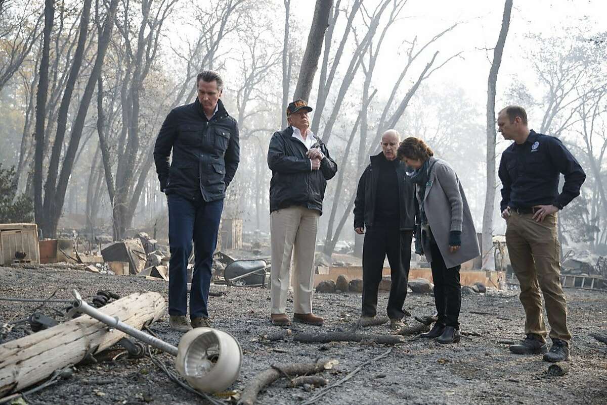 President Donald Trump tours fire-ravaged homes in Paradise, Calif., Nov. 17, 2018. The Federal Emergency Management Agency, often maligned for its response to prominent natural disasters, is quietly helping California respond to and recover from the wildfires across the state, including the deadliest in the state’s recorded history. From left: Gavin Newsom, the governor-elect; Trump; Gov. Jerry Brown; Jody Jones, the mayor of Paradise; and Brock Long, the FEMA director. (Tom Brenner/The New York Times)