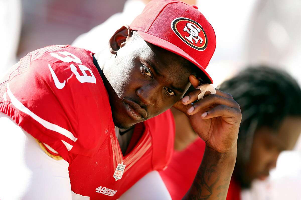 San Francisco 49ers' Aldon Smith sits on bench in final minutes of 34-0 loss to Denver Broncos during NFL preseason game at Levi's Stadium in Santa Clara, Calif. on Sunday, August 17, 2014.