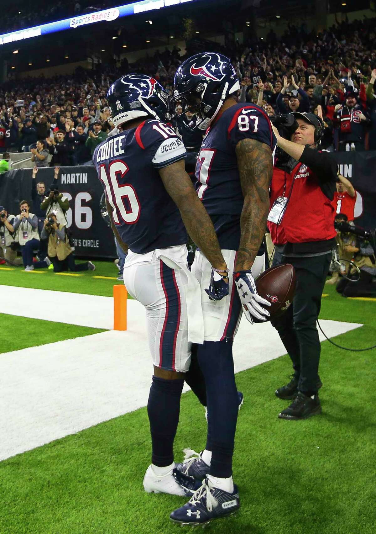 Houston Texans wide receiver Demaryius Thomas (87) and wide receiver Keke Coutee (16) celebrate a touchdown by Thomas during the first quarter of an NFL football game at NRG Stadium, Monday, Nov. 26, 2018, in Houston.