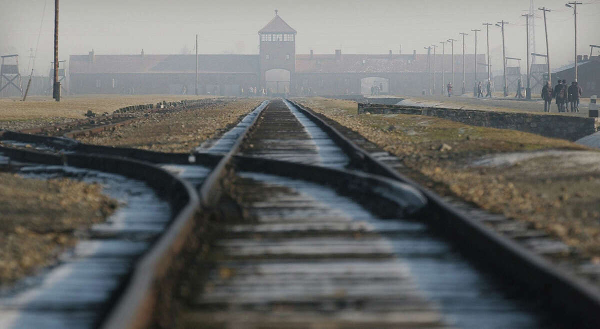 Rails lead to the former Nazi death camp Auschwitz-Birkenau in Oswiecim, southern Poland, in this file photo. A controversial Burning Man art installation that showed Barbie dolls being marched into ovens at last week's festival is reportedly being investigated by the Anti-Defamation League in San Francisco.