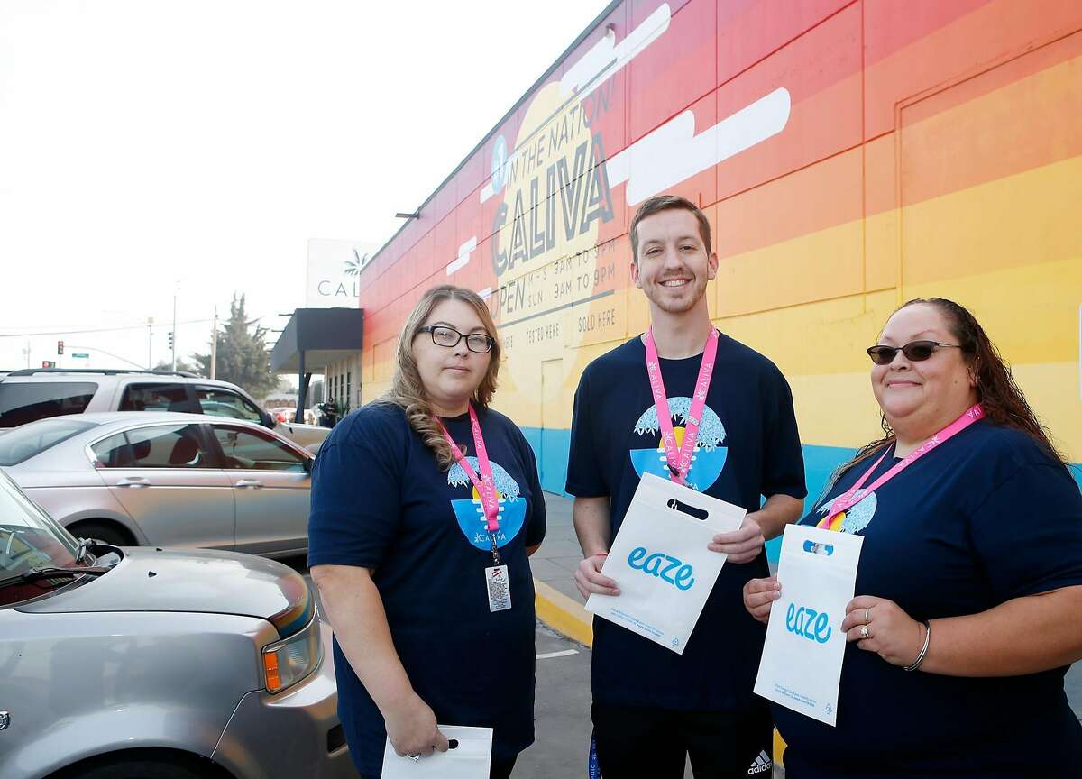 Drivers Jennifer Rodriguez, left, Nicholas Robbins, center, and Lilianna Carrasco, right, pose for a photograph at Caliva in San Jose, Calif., on Nov. 20, 2018. Uber, Lyft drivers are fleeing to become marijuana-delivery drivers � the new in-demand job in the on-demand economy. Caliva employs more than a hundred drivers. (Josie Lepe/Special to the Chronicle)
