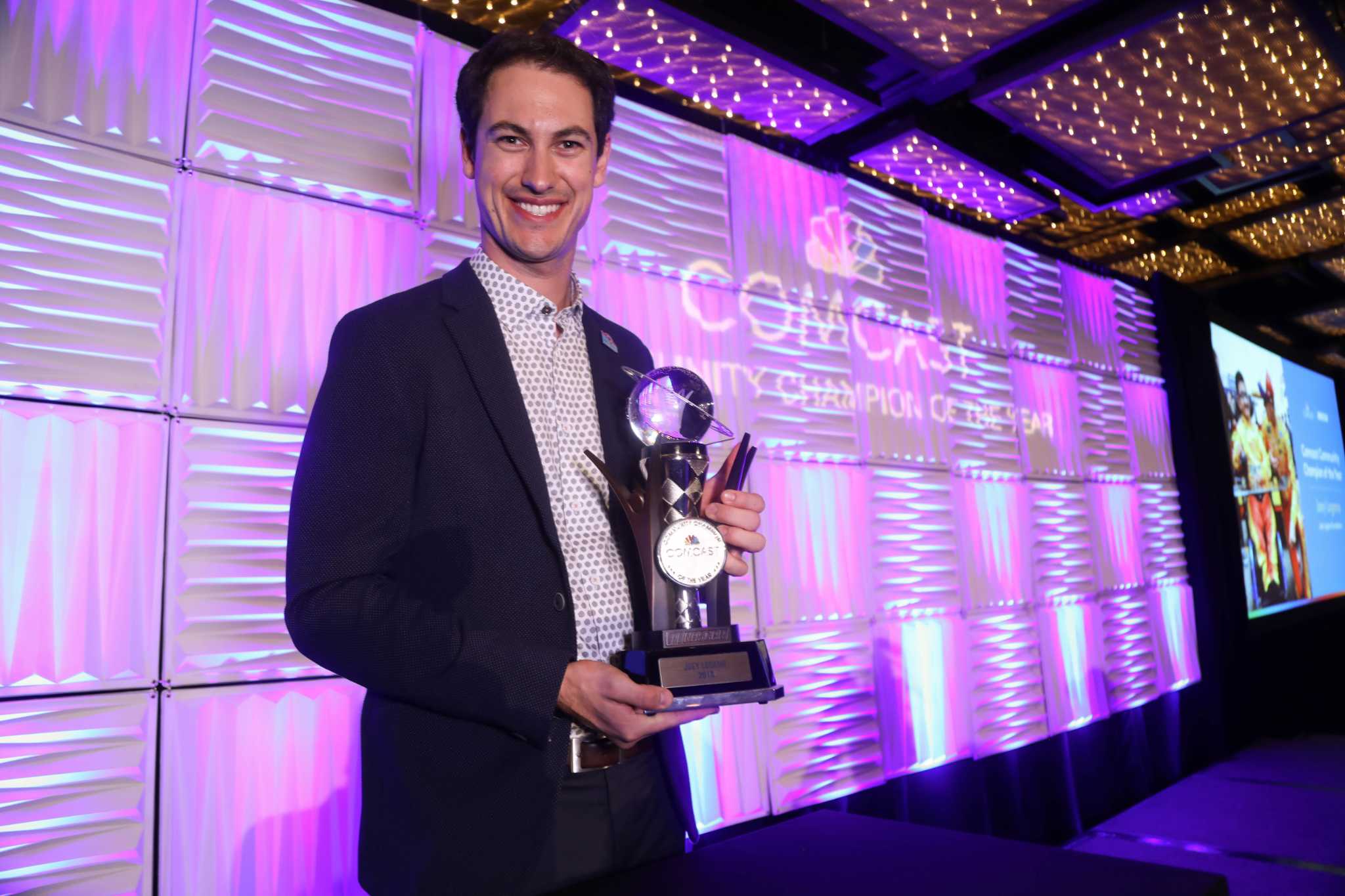 Comcast honors NASCAR champ Joey Logano for charitable efforts