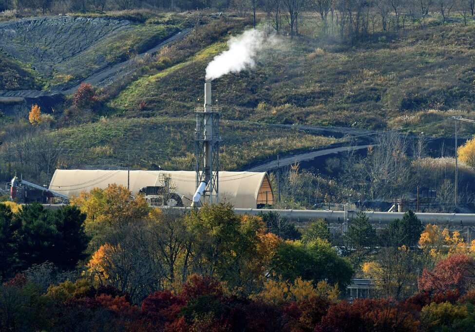 Emissions rise from the Norlite plant on Wednesday, Nov. 7, 2018, in Cohoes, N.Y. Owners of the state's only commercial hazardous waste incinerator are announcing a $30 million project to upgrade pollution control equipment. (Will Waldron/Times Union)