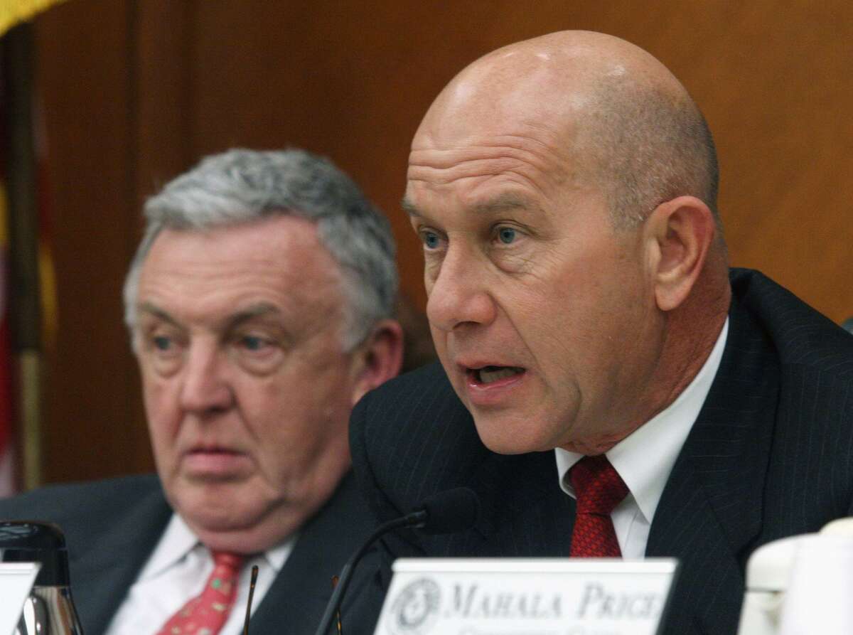 In this Jan. 30, 2007 file photo, Senate Criminal Justice Committee chairman Sen. John Whitmire, D-Houston, right, and House Corrections Committee chairman Rep. Jerry Madden, R-Richardson, discuss prison overcrowding problems during a joint committee hearing in Austin.