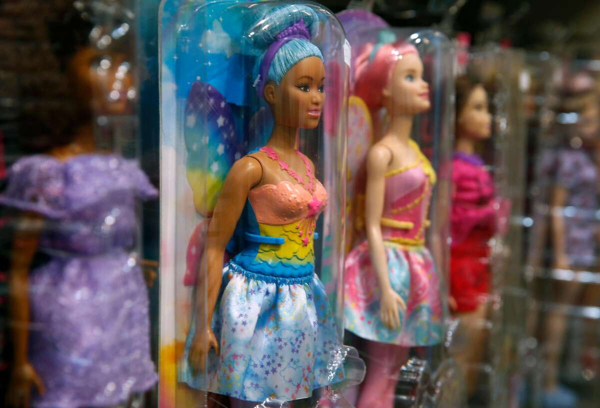 Barbie dolls line a shelf at Jeffrey's Toys store on Black Friday in San Francisco, Calif. on Friday, Nov. 23, 2018.