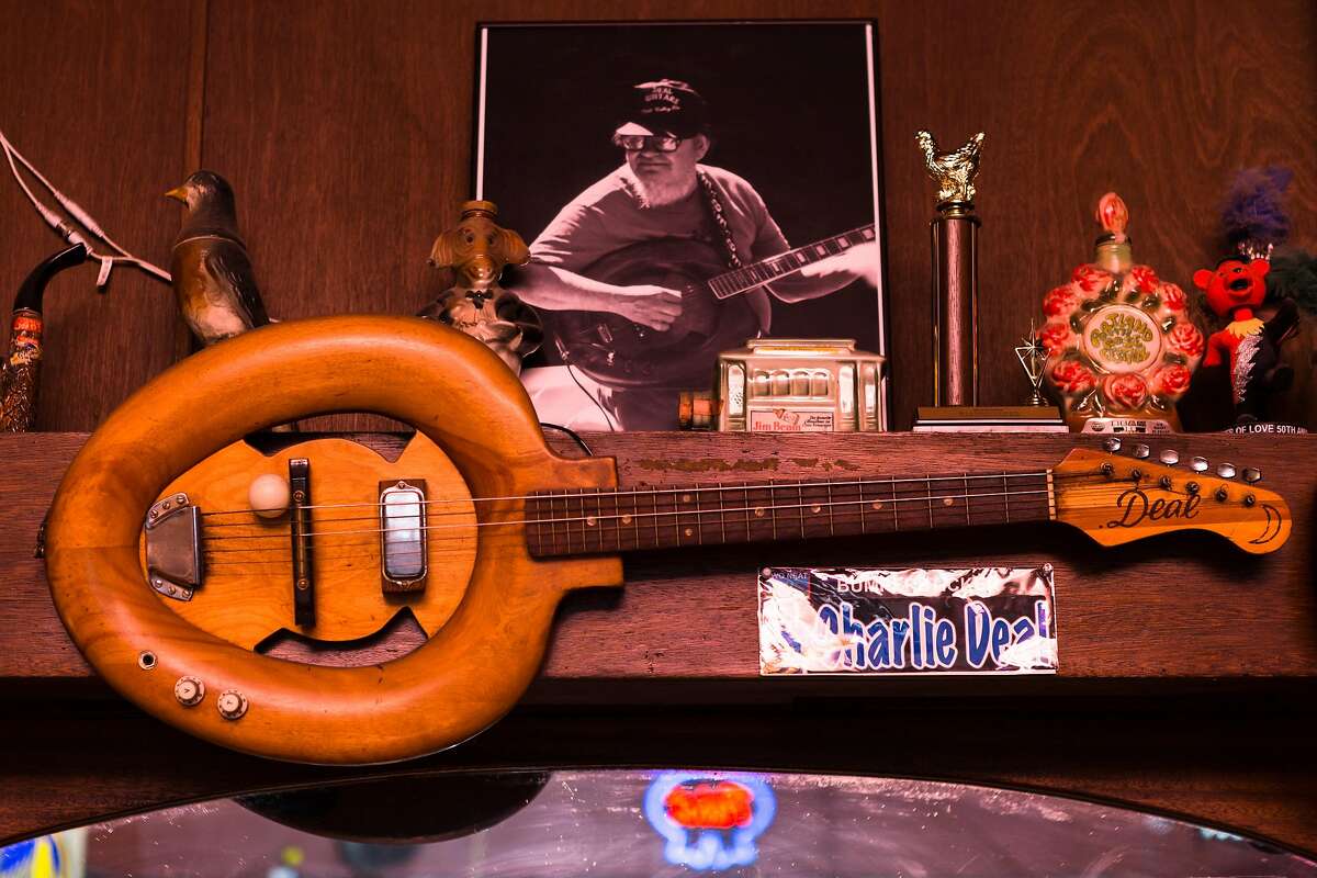 The toilet seat guitar created by Charlie Deal hangs behind the bar at 2 AM Club in Mill Valley, Calif. on Tuesday, November 27, 2018.