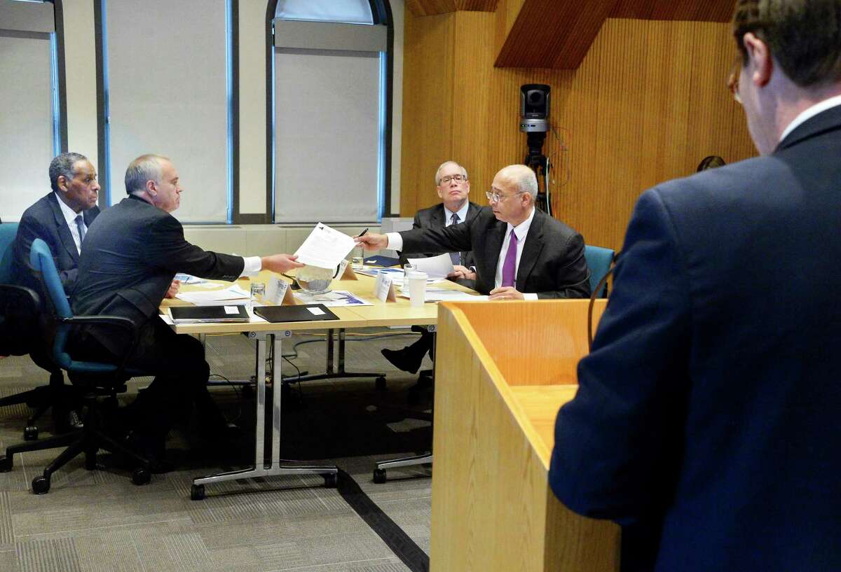 NYS Compensation Committee members, from left, H. Carl McCall, Tom DiNapoli, Scott Stringer and William Thompson, Jr. listen to testimony from Blair Horner, right, of NYPIRG during a public hearing Wednesday Nov. 28, 2018 in Albany, NY. The committee is tasked with recommending raises for state legislators and other public officials. (John Carl D'Annibale/Times Union)