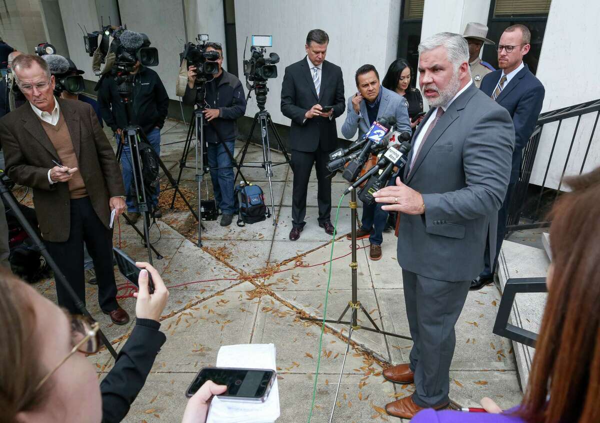 Montgomery County District Attorney Breet Ligon talks to reporters outside the Chancery of the Archdiocese of Galveston-Houston Wednesday, Nov. 28, 2018, in Houston. Authorities conducted a search warrant of the building.