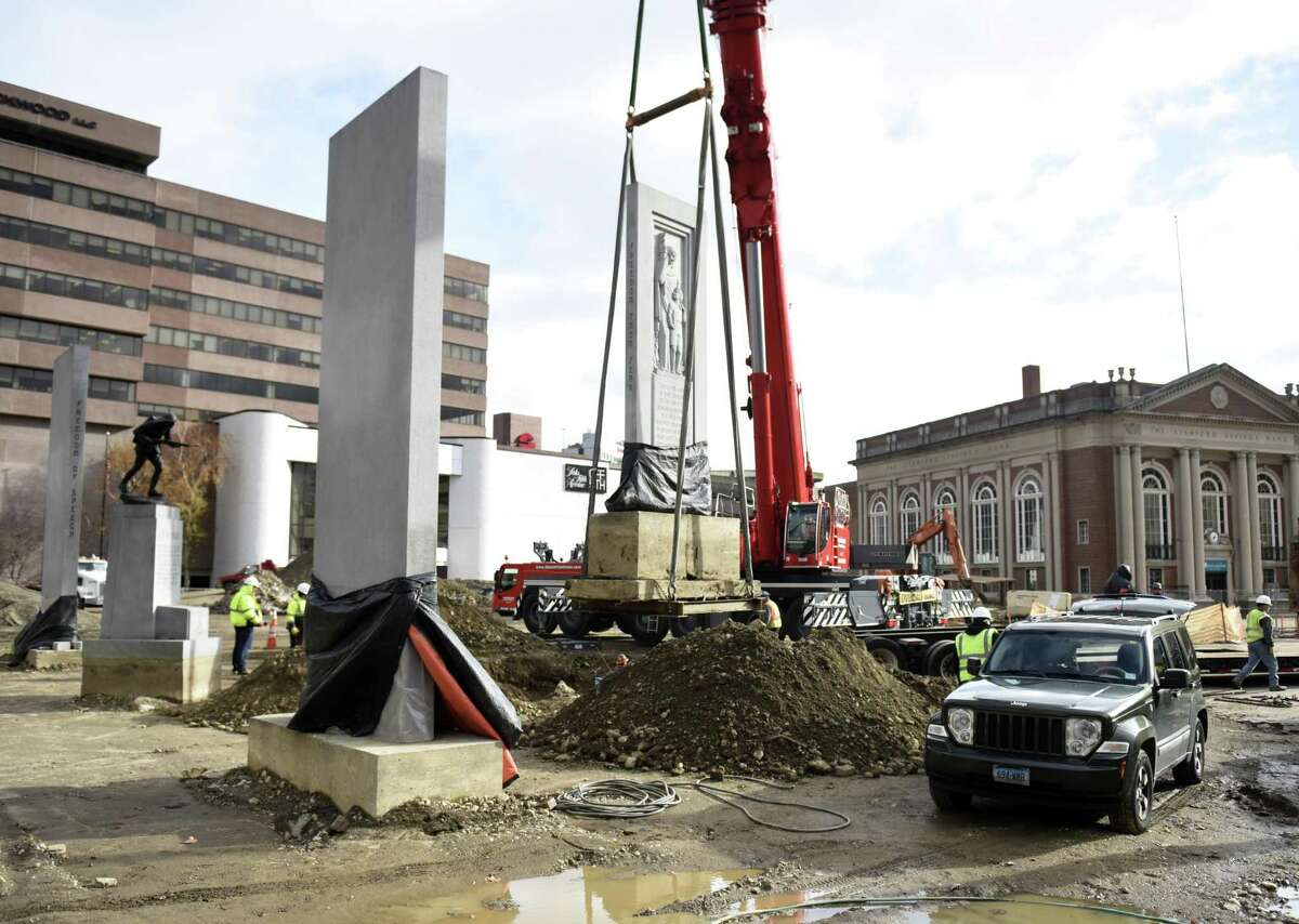 A crane moves the large "Freedom From Fear" monolith to a new location within Veterans Memorial Park in Stamford, Conn. Wednesday, Nov. 28, 2018. The monolith was moved to a new spot as part of the city's expansive renovation project at the park.