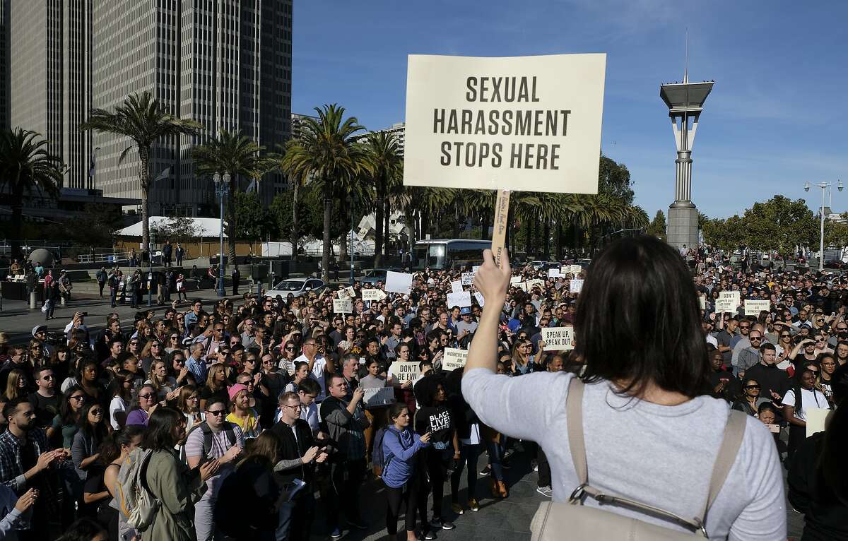 Google employees fill Harry Bridges Plaza during a walkout Thursday, Nov. 1, 2018, in San Francisco. Carrying signs with messages such as "Don't be evil," several thousand Google employees around the world briefly walked off the job Thursday in a protest against what they said is the tech company's mishandling of sexual misconduct allegations against executives. (AP Photo/Eric Risberg)