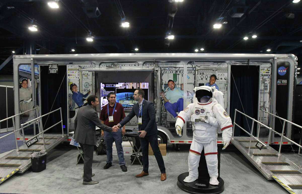 A NASA display on the show floor at the annual SpaceCom (Space Commerce Conference and Exposition) Tuesday, Nov. 27, 2018, in Houston.
