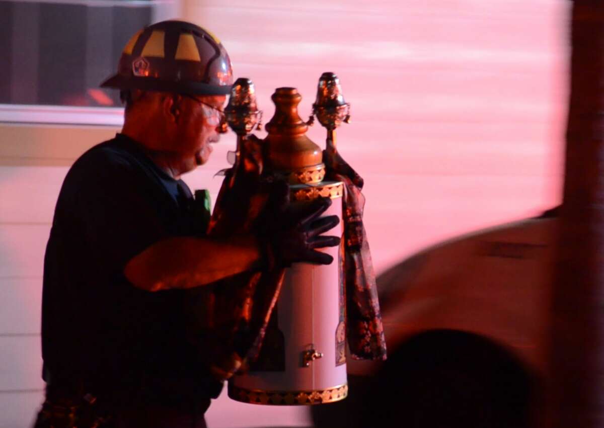 Houston firefighters battle a fire at the Torah Vachesed synagogue on South Braeswood Boulevard near Hillcroft Avenue on Wednesday, Nov. 29, 2018. Firefighters were able to save the synagogue's holy Torah scrolls from ruin.