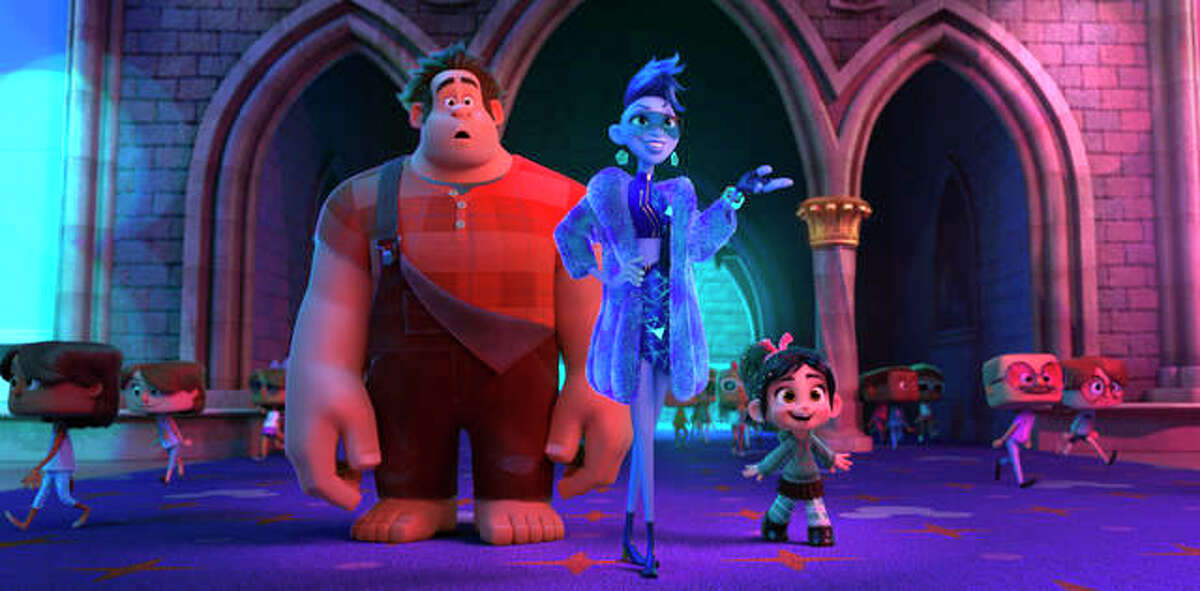 This image released by Disney shows characters, from left, Ralph, voiced by John C. Reilly, Yess, voiced by Taraji P. Henson and Vanellope von Schweetz, voiced by Sarah Silverman in a scene from “Ralph Breaks the Internet.”