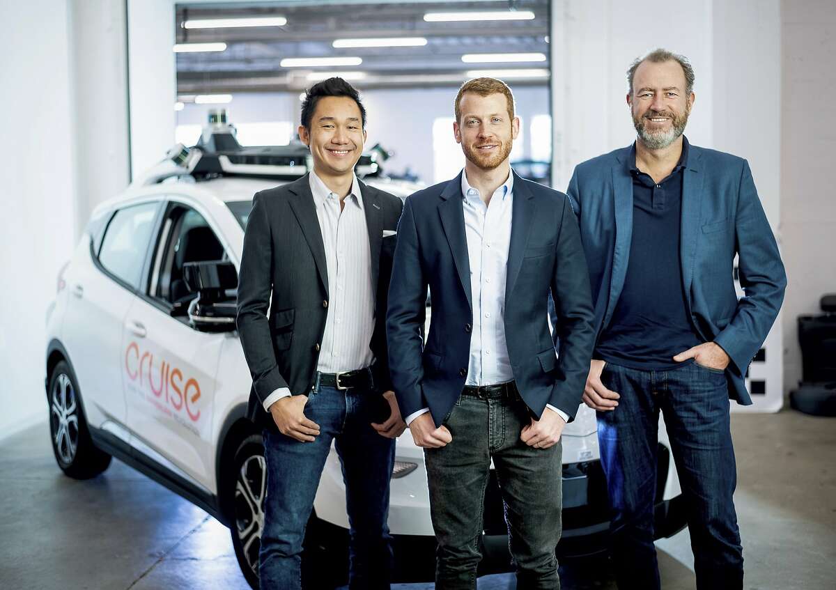 In this Nov. 20, 2018, photo provided by General Motors/Cruise, from left, Cruise Automation's Dan Kan and Kyle Vogt pose for a photo with General Motors' Dan Ammann at Cruise Automation offices in San Francisco, Calif. General Motors’ No. 2 executive is moving from Motor City to Silicon Valley to run the automaker’s self-driving car operations as it attempts to cash in on its bet that robotic vehicles will transform transportation. In a transition announced Thursday, Nov. 29, GM President Ammann will become CEO of the company’s Cruise Automation subsidiary at the beginning of next year. He will replace Cruise co-founder Vogt, who will become chief technology officer. (Noah Berger/General Motors, Cruise via AP)