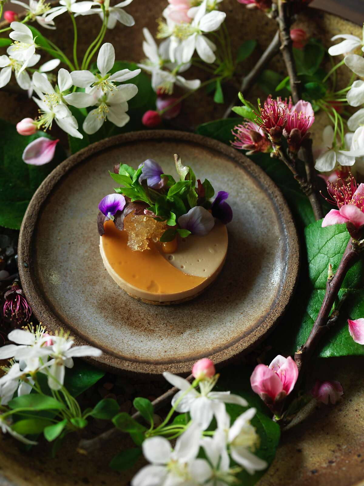 HEALDSBURG, CALIF - March 19, 2017: Foie gras with gelee of momo-shu (a peach wine we made with last year's green peaches), pickled peach blossoms, seeded sable', olive oil jam, and almond cream at SingleThread Farms in Healdsburg. PHOTO BY JOHN LEE