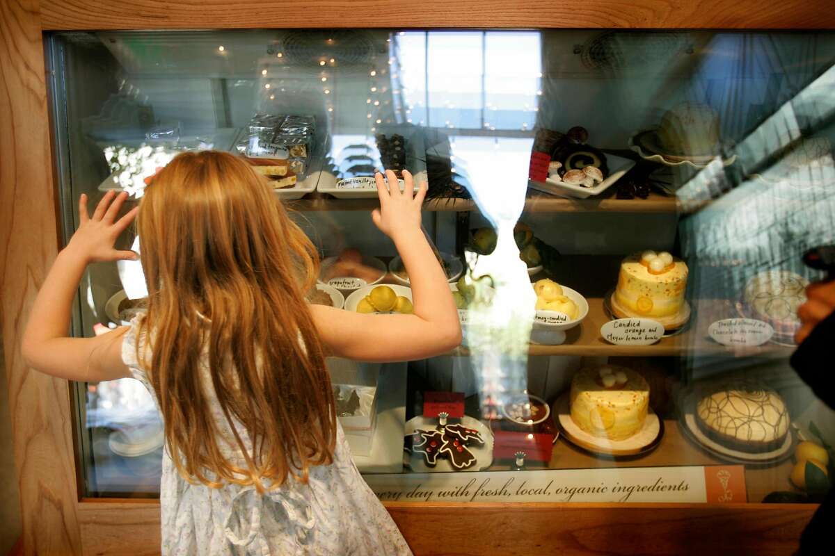 07DEC06_jmm001.jpg Pia Mahar Morton, 5, checks out the display at Ici Ice Cream on College Ave. in Berkeley, CA. Pia's mother Darian Mahar got her two scoops of handmade ice cream on Wednesday afternoon December 6, 2006. Jim Merithew/San Francisco Chronicle Ran on: 06-03-2007