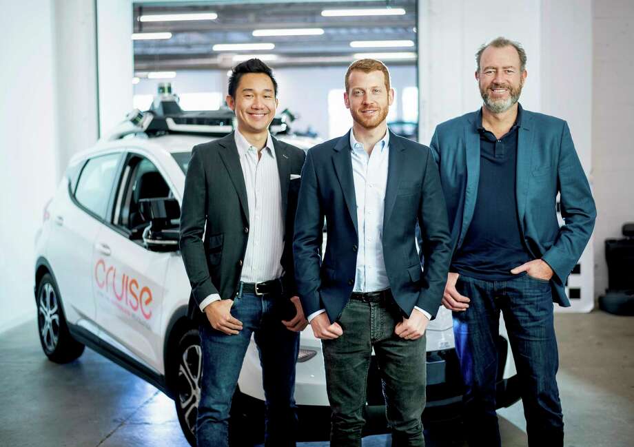 In this Nov. 20, 2018, photo provided by General Motors/Cruise, from left, Cruise Automation's Dan Kan and Kyle Vogt pose for a photo with General Motors' Dan Ammann at Cruise Automation offices in San Francisco, Calif. General Motors No. 2 executive is moving from Motor City to Silicon Valley to run the automakers self-driving car operations as it attempts to cash in on its bet that robotic vehicles will transform transportation. In a transition announced Thursday, Nov. 29, GM President Ammann will become CEO of the companys Cruise Automation subsidiary at the beginning of next year. He will replace Cruise co-founder Vogt, who will become chief technology officer. (Noah Berger/General Motors, Cruise via AP) Photo: Noah Berger / © 2018 Noah Berger, General Motors and Cruise Automation. This i