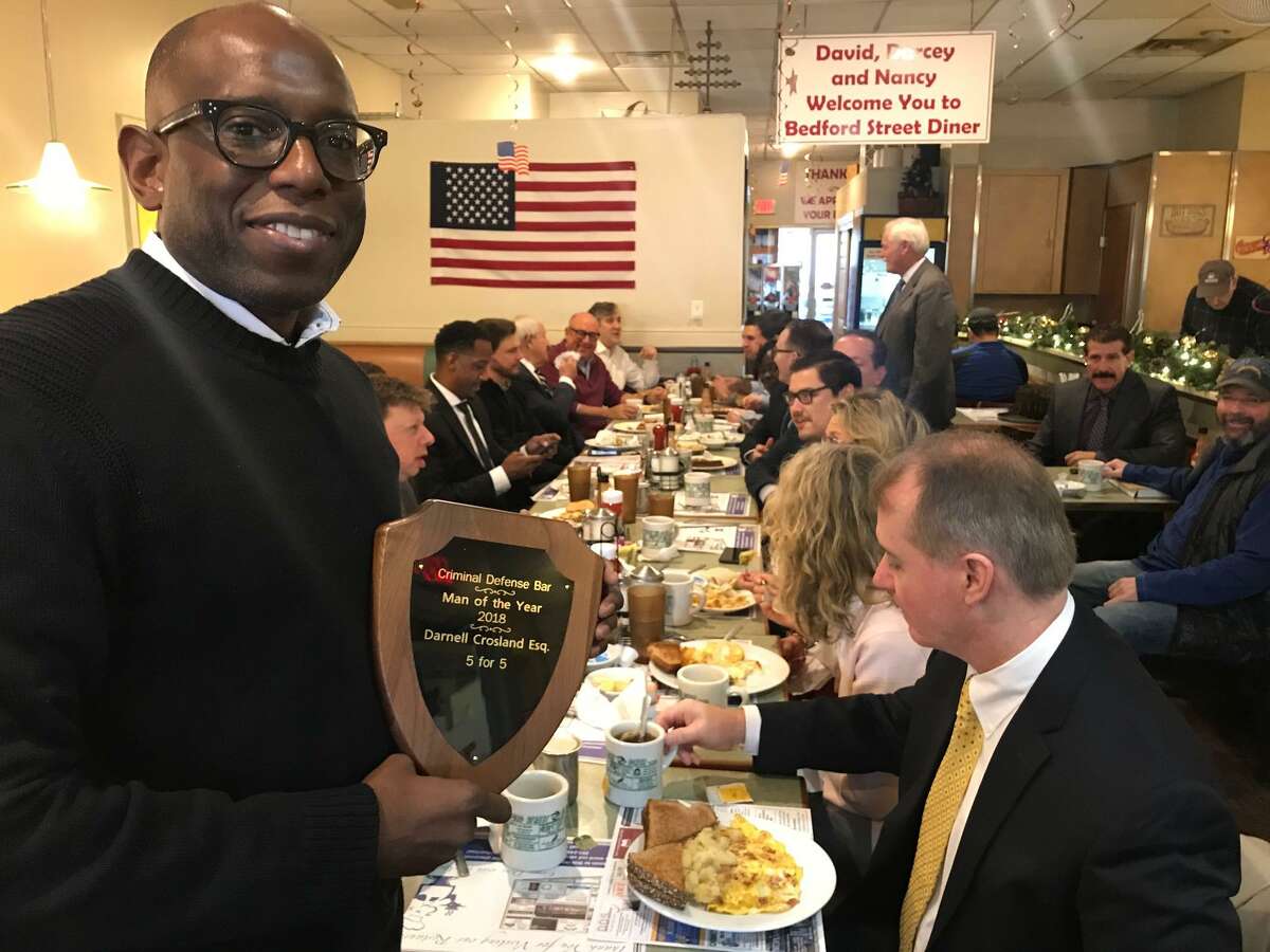 Attorney Darnell Crosland receiving a Man of the Year award from Stamford criminal defense attorneys on Nov. 30, 2018 at the Bedford Diner.