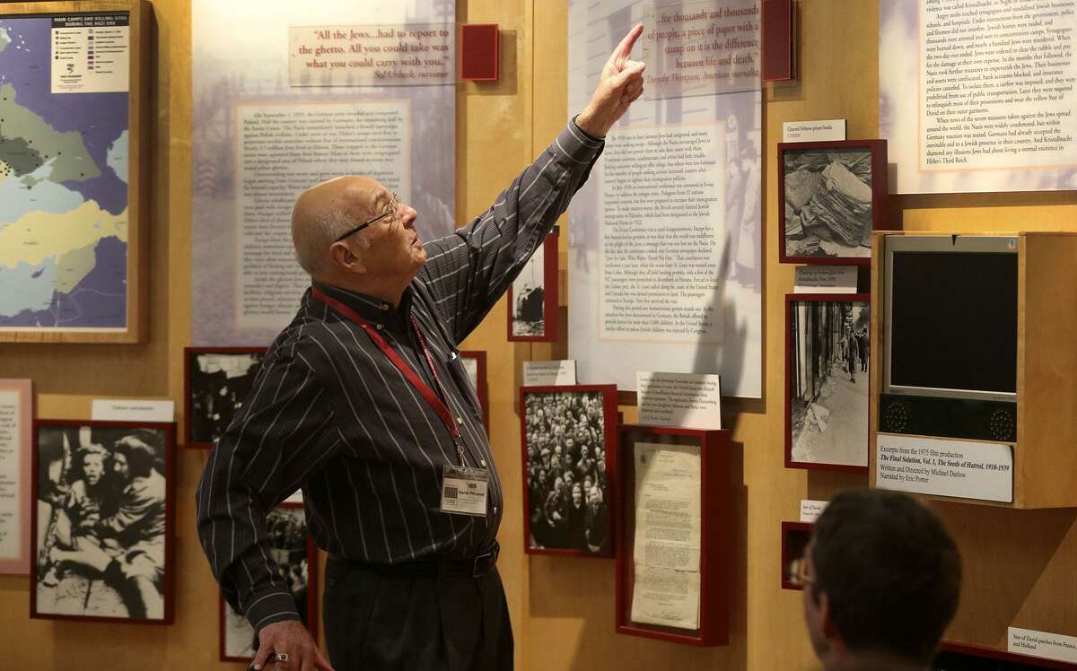Gov. Greg Abbott has signed a new state law calling for public schools to teach about tolerance, genocide and the Holocaust at every grade level starting this year. Above, Holocaust Memorial Museum docent David Present speaks October 19, 2016, to a group of middle school students about the Holocaust.