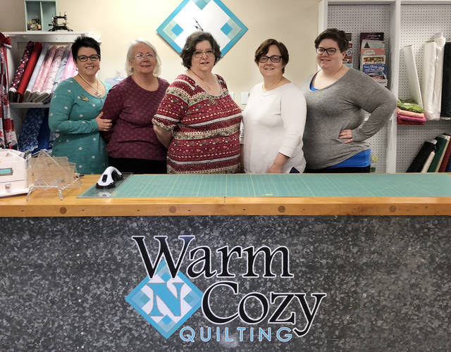 Illinois SBDC for Metro East client Warm N Cozy Quilting expands in