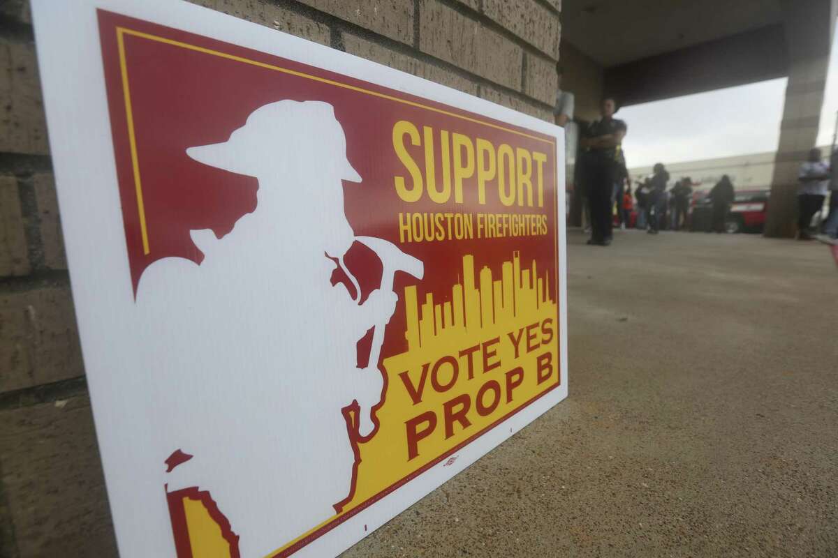 HFD firefighters bring support signs to the poll at the Fiesta Mart on Kirby Drive and Old Spanish Trail to advocate for Prop B on Election Day on Tuesday, Nov. 6, 2018, in Houston.