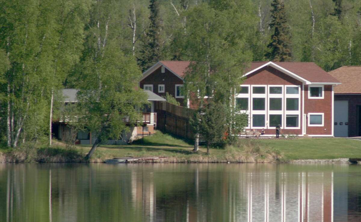 FILE - Former Alaska Gov. Sarah Palin's house, right, on Lake Lucille in Wasilla, Alaska is photographed on Thursday, May 27, 2010.